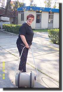 Maureen collects water at Londra camping.